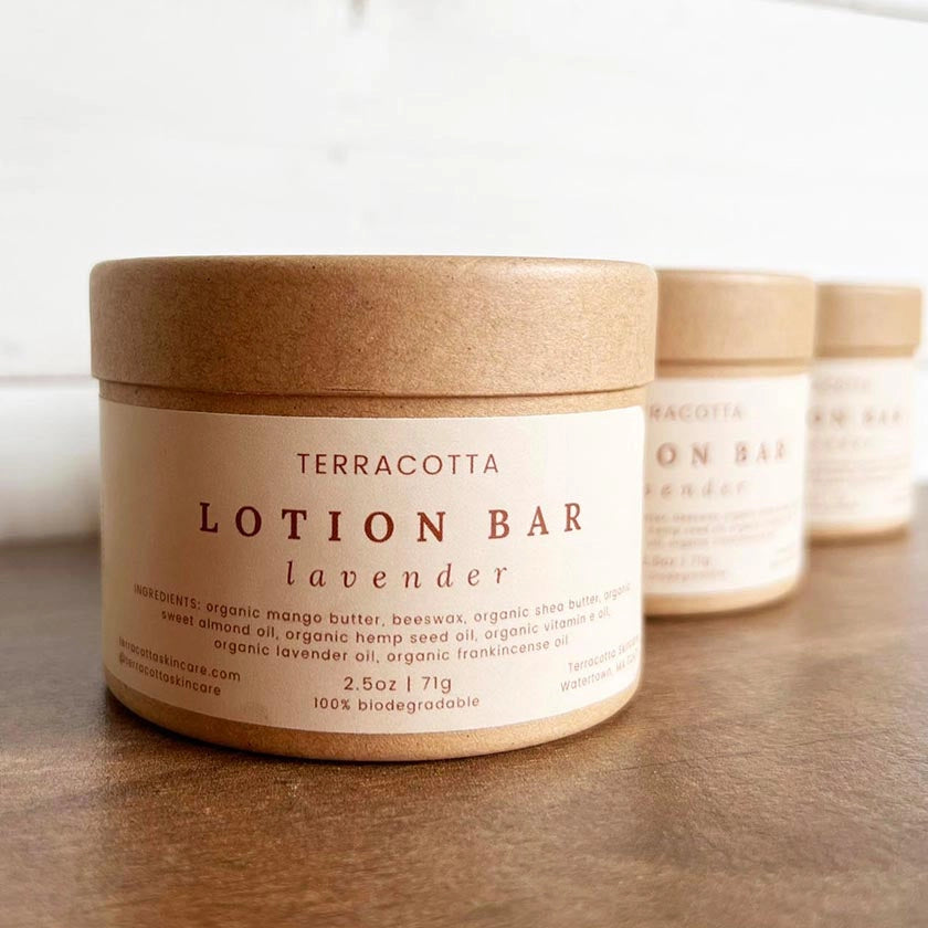 Three containers of Terracotta Skincare Lotion Bars in 'Lavender'