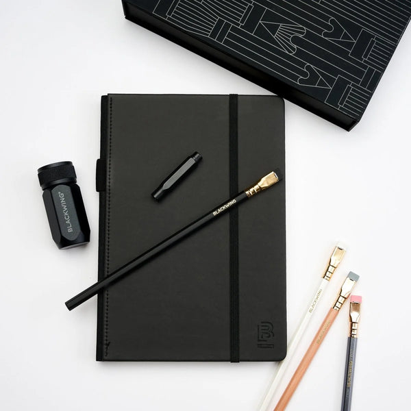 A blackwing essentials journaling kit featuring a few fancy pencils, a sharpener, and a glamorous black journal (one of the raffle items generously donated by Eryngium)