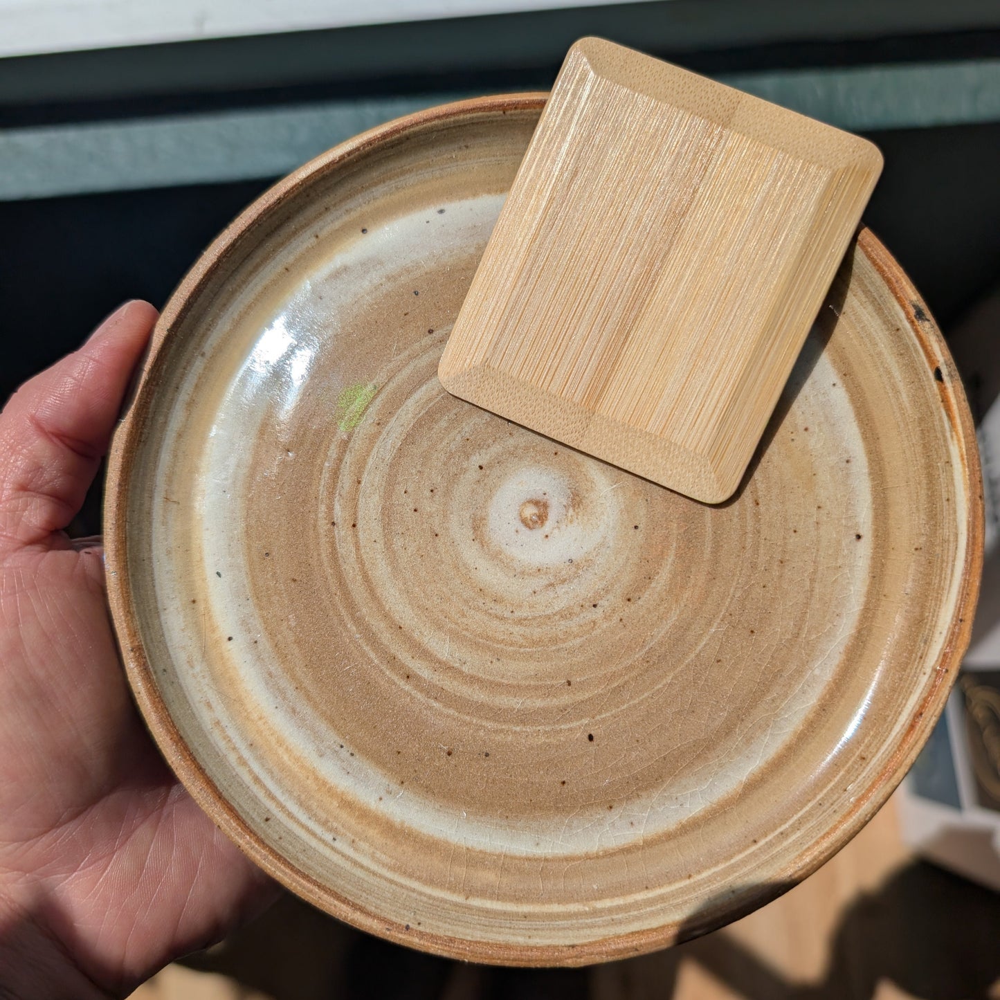 bamboo pot scraper on a ceramic dish