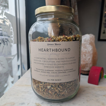 Glass jar labeled 'Hearthbound' filled with custom tea blend