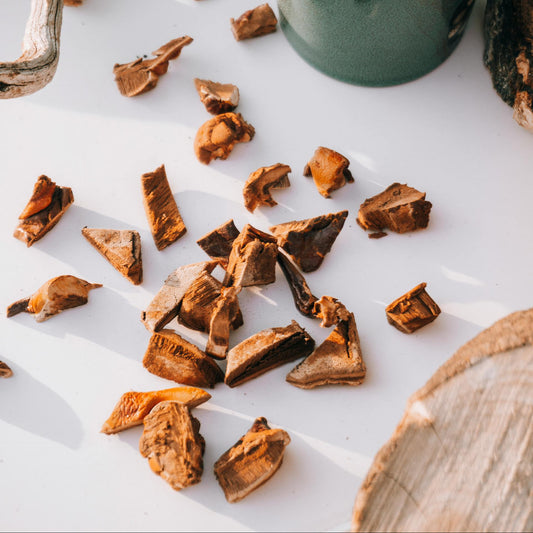 Dried herbs on a white surface.
