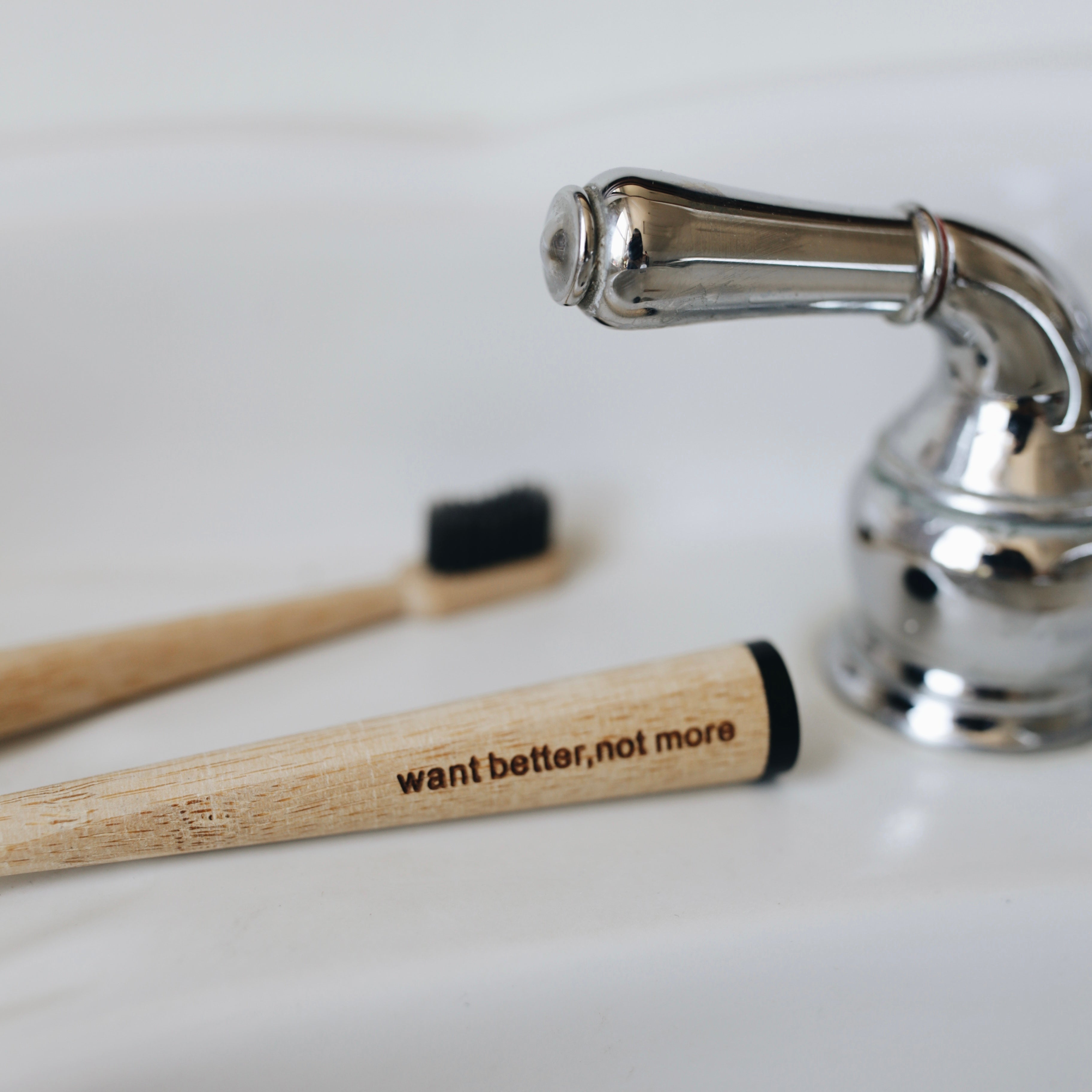 close up of bamboo toothbrush in sink